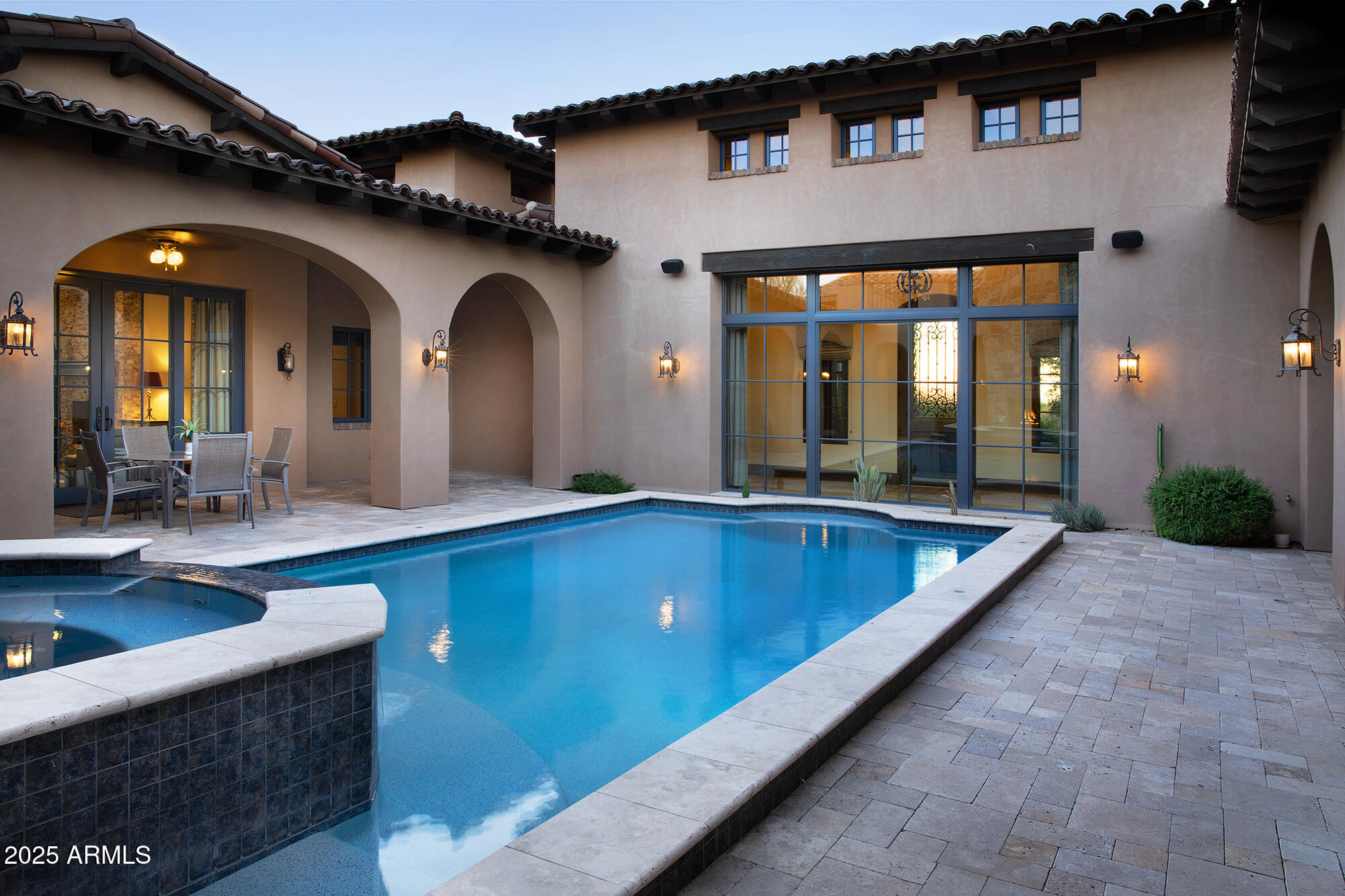 19481 North 98th Place Scottsdale, AZ 85255 - Photo 12 of 34 a large pool with table and chairs in it
