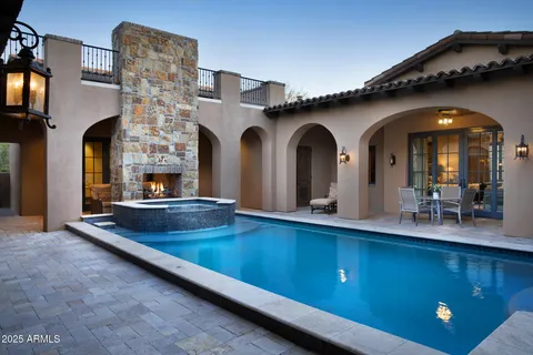a living room with fireplace furniture and a flat screen tv