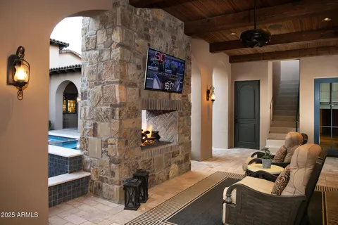 a view of hall way with furniture and chandelier
