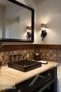 a bathroom with a stove and cabinets