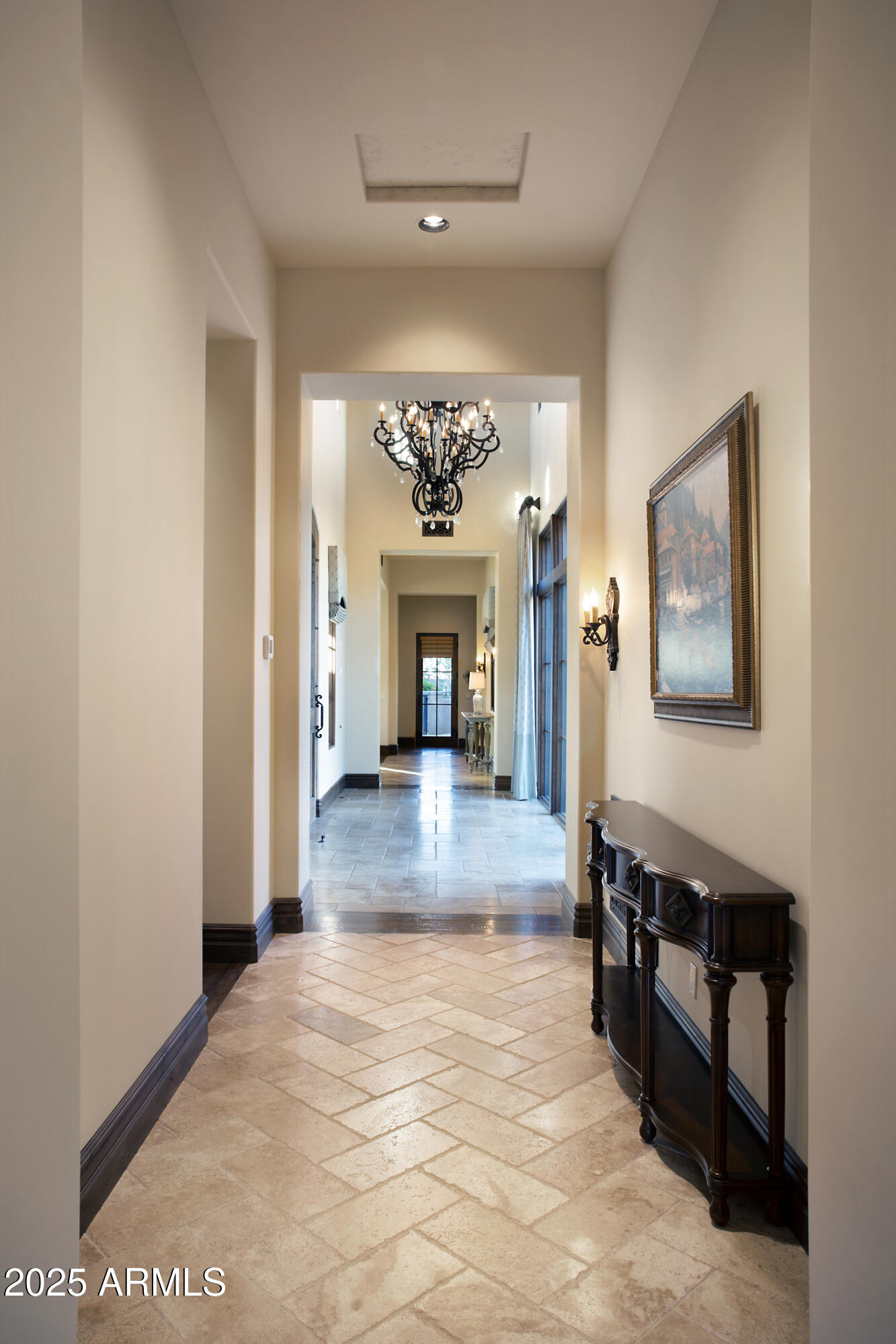 19481 North 98th Place Scottsdale, AZ 85255 - Photo 17 of 34 a view of a big room with a fireplace and a chandelier