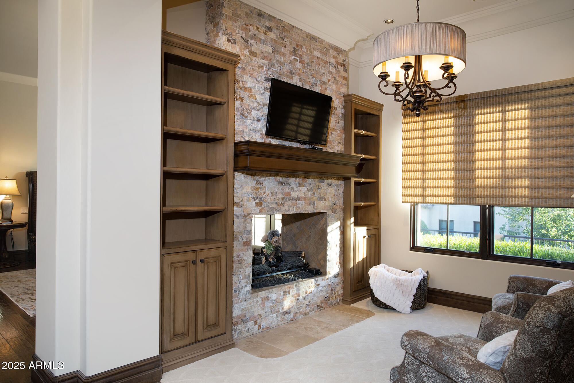 19481 North 98th Place Scottsdale, AZ 85255 - Photo 20 of 34 a living room with furniture and a fireplace