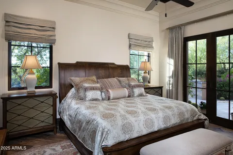 a bedroom with a large bed and a window