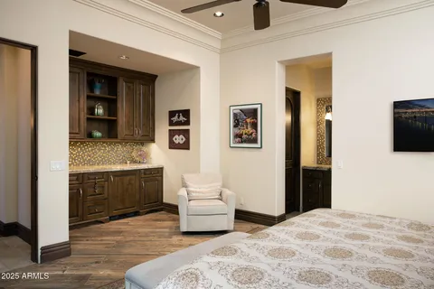 a bedroom with a bed and a couch