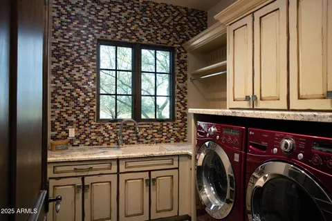 a utility room with dryer and washer