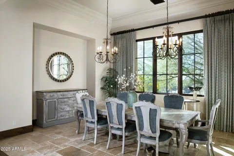 a view of a dining room with furniture window and outside view