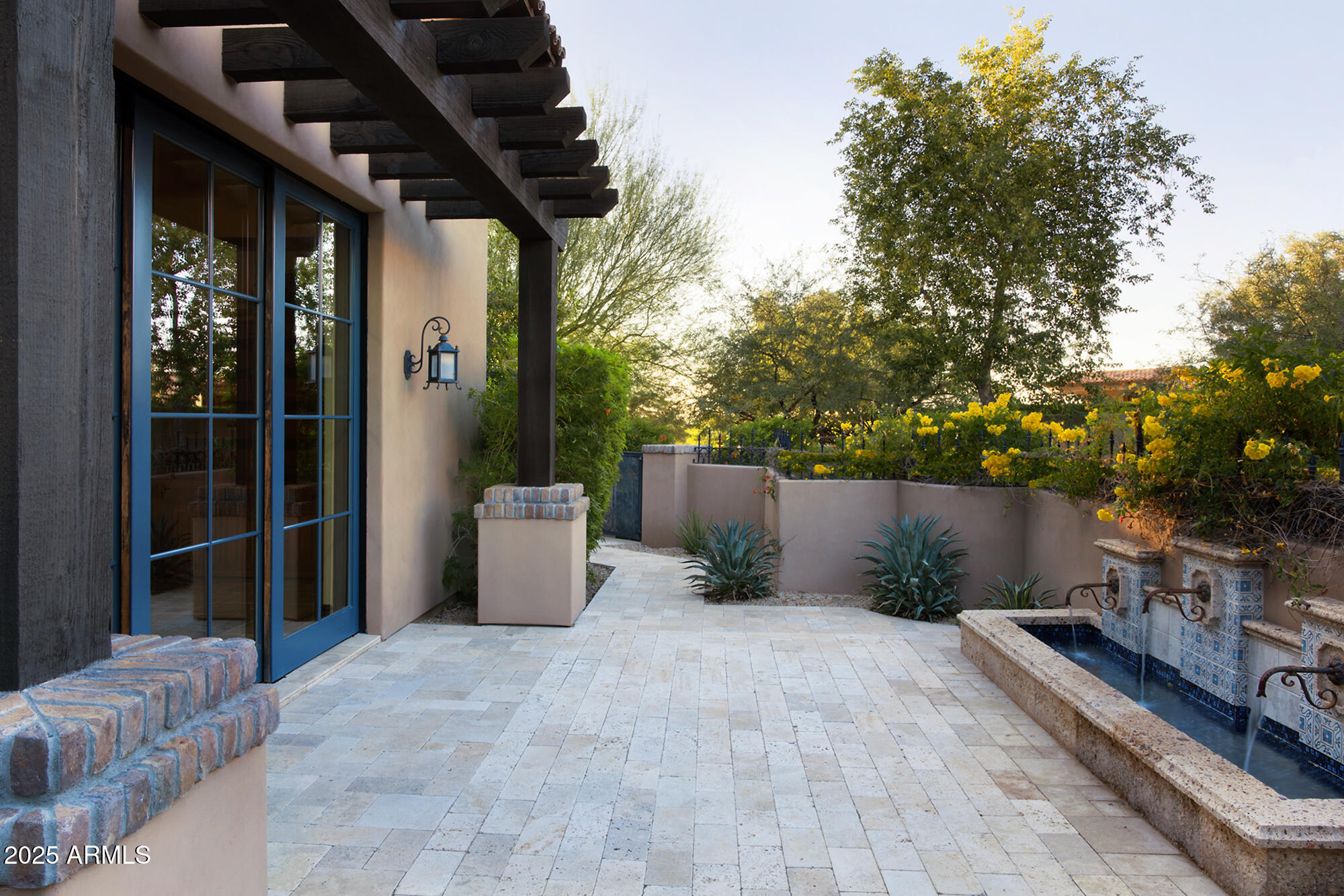 19481 North 98th Place Scottsdale, AZ 85255 - Photo 6 of 34 a view of a chairs and table in backyard