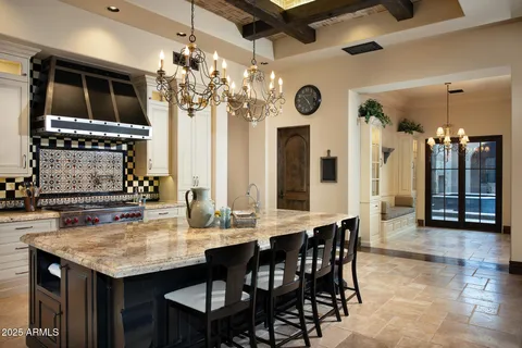 a kitchen with a table and chairs in it