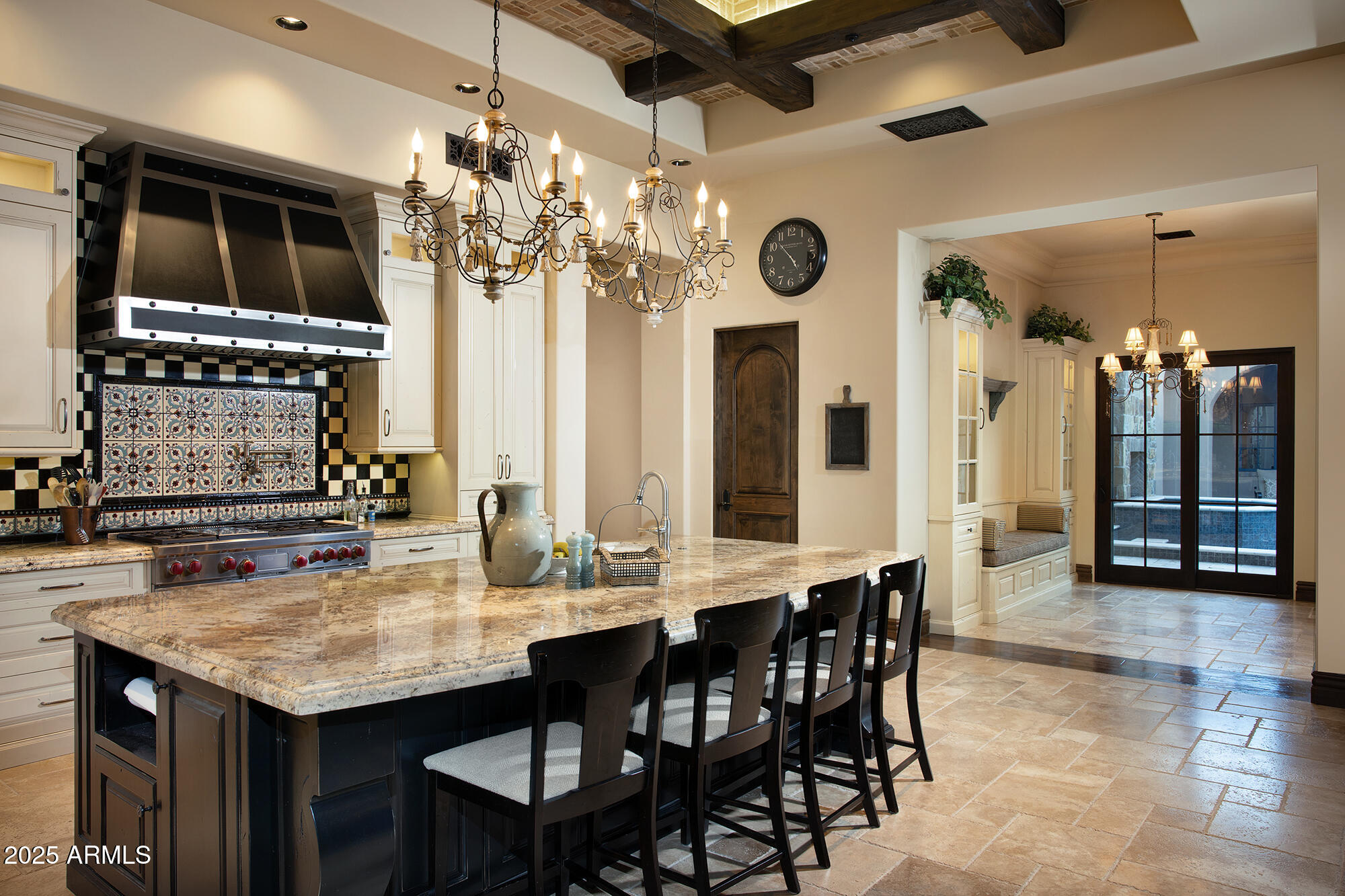 19481 North 98th Place Scottsdale, AZ 85255 - Photo 8 of 34 a kitchen with a table and chairs in it