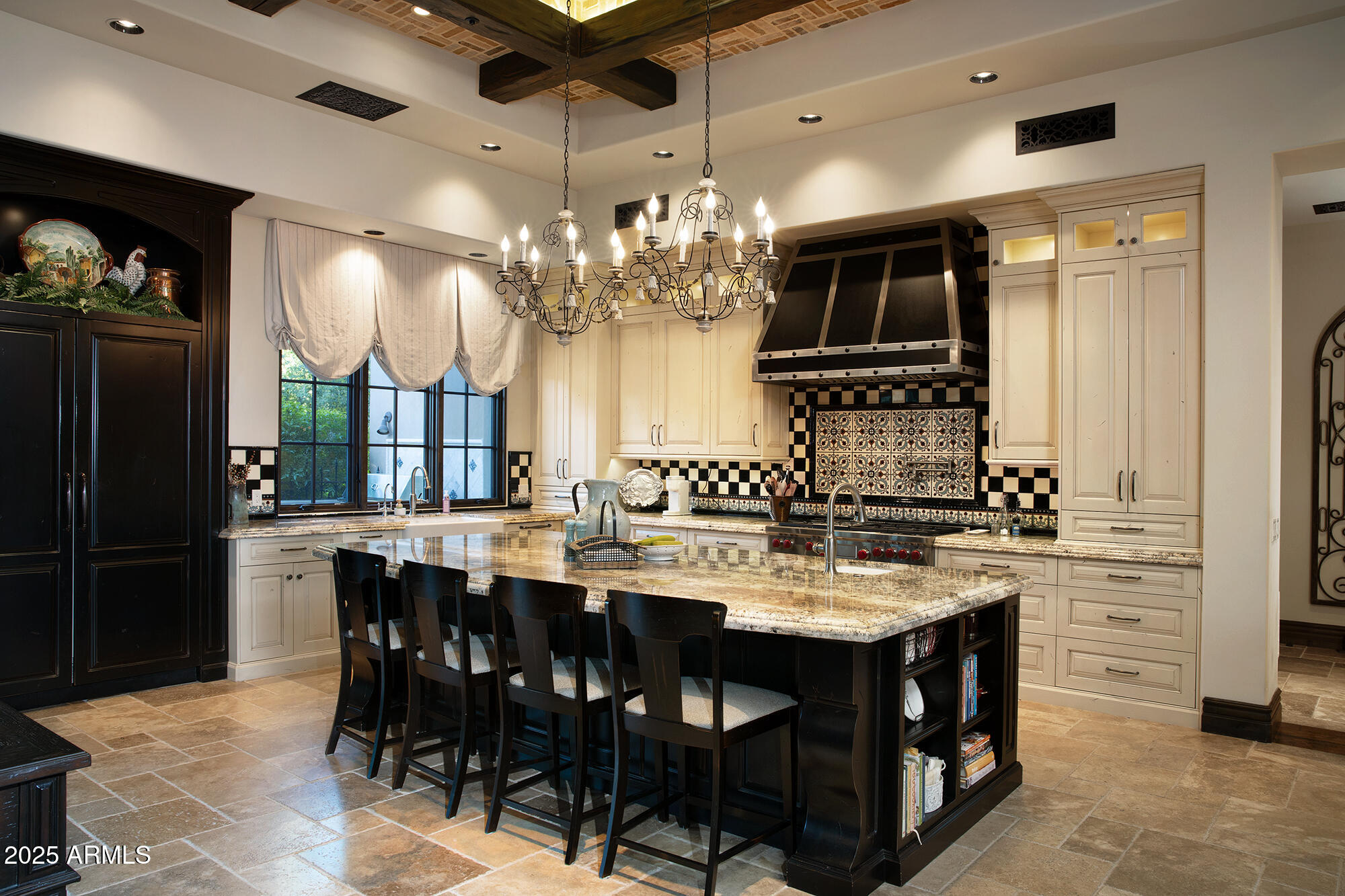 19481 North 98th Place Scottsdale, AZ 85255 - Photo 9 of 34 a kitchen with cabinets and chairs