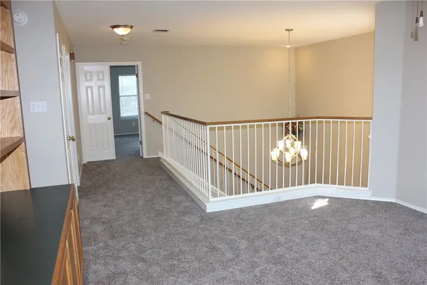 a view of hallway with windows