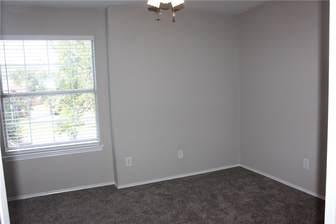 7801 Varcella Trail Austin, TX 78729 - Photo 16 of 26 an empty room with a window
