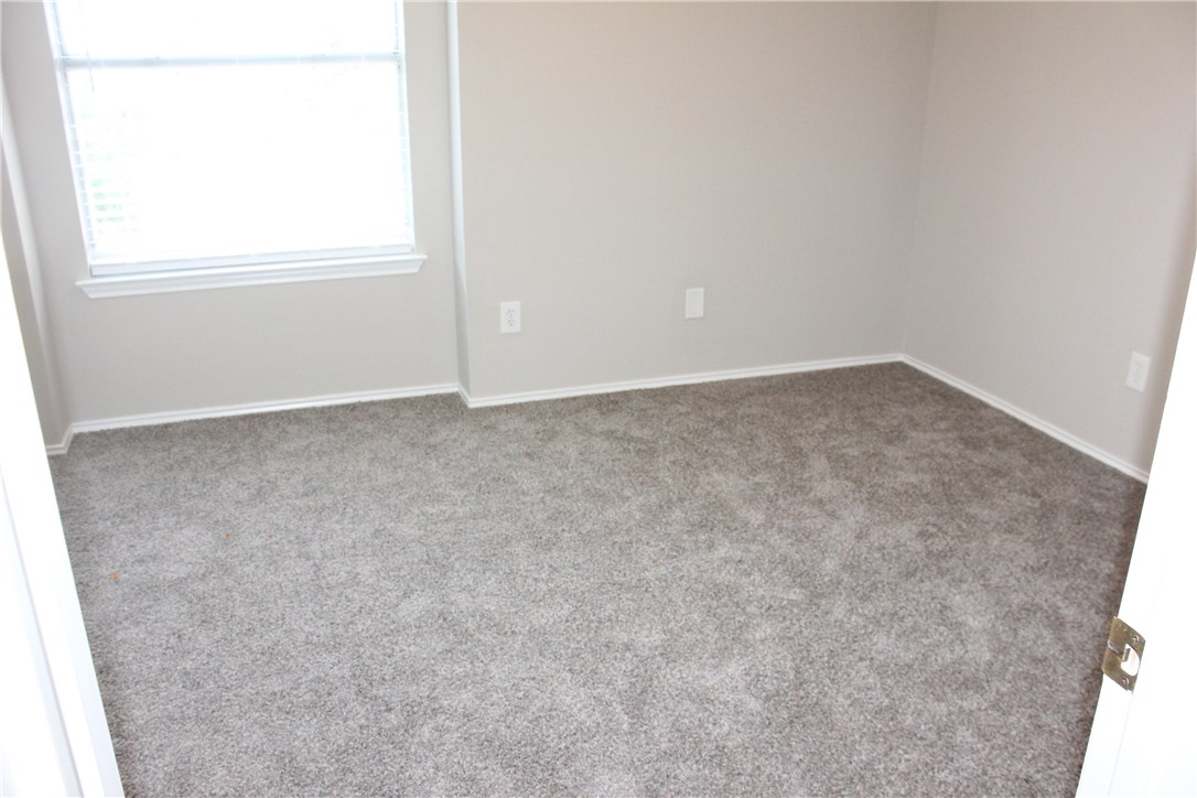 7801 Varcella Trail Austin, TX 78729 - Photo 17 of 26 an empty room with a window