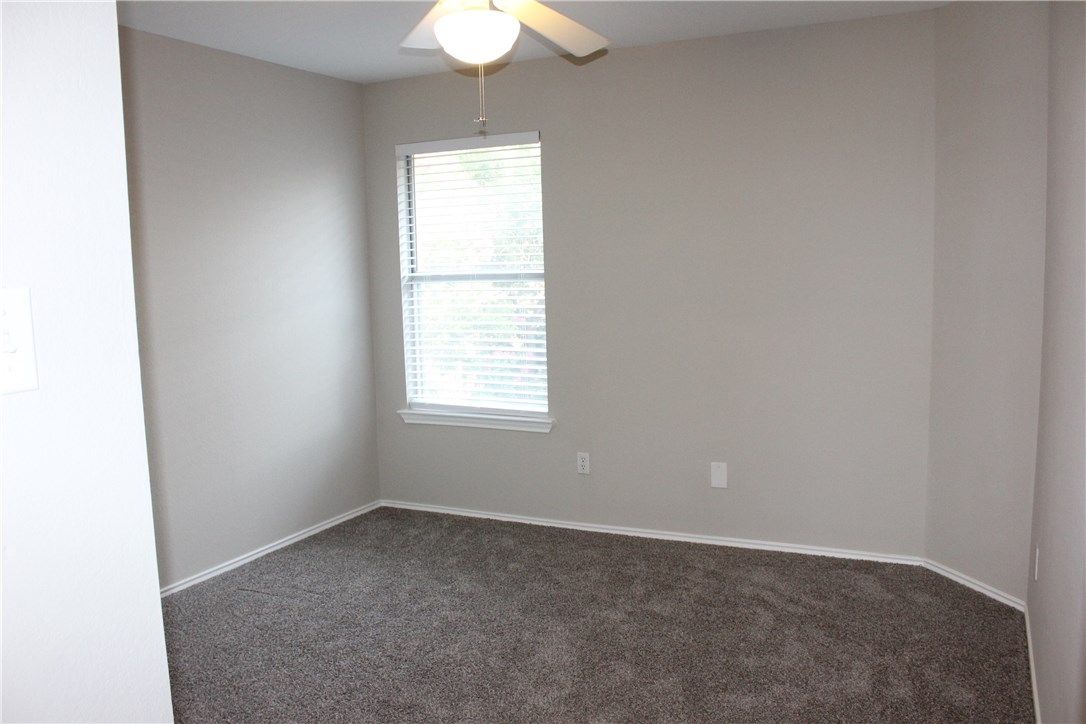 7801 Varcella Trail Austin, TX 78729 - Photo 18 of 26 an empty room with a window