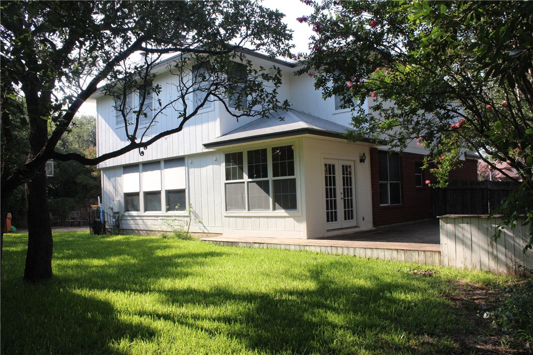 7801 Varcella Trail Austin, TX 78729 - Photo 20 of 26 a view of house with a yard