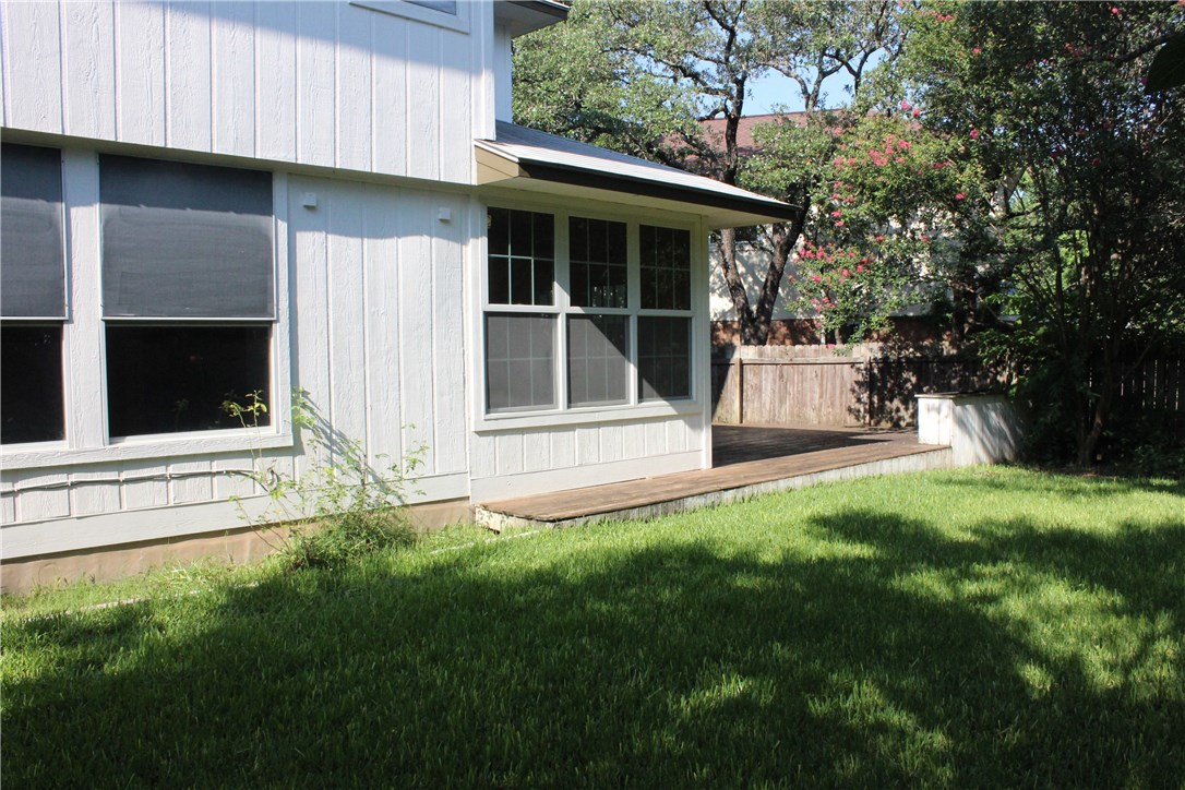 7801 Varcella Trail Austin, TX 78729 - Photo 21 of 26 a view of a backyard with a large tree