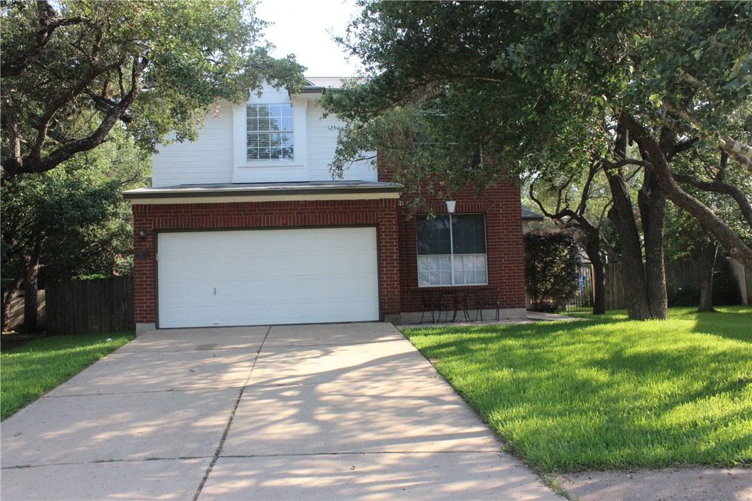 7801 Varcella Trail Austin, TX 78729 - Photo 25 of 26 a front view of a house with a yard