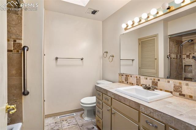 2913 Marilyn Road Colorado Springs, CO 80909 - Photo 22 of 34 Updated Main Bath on main level