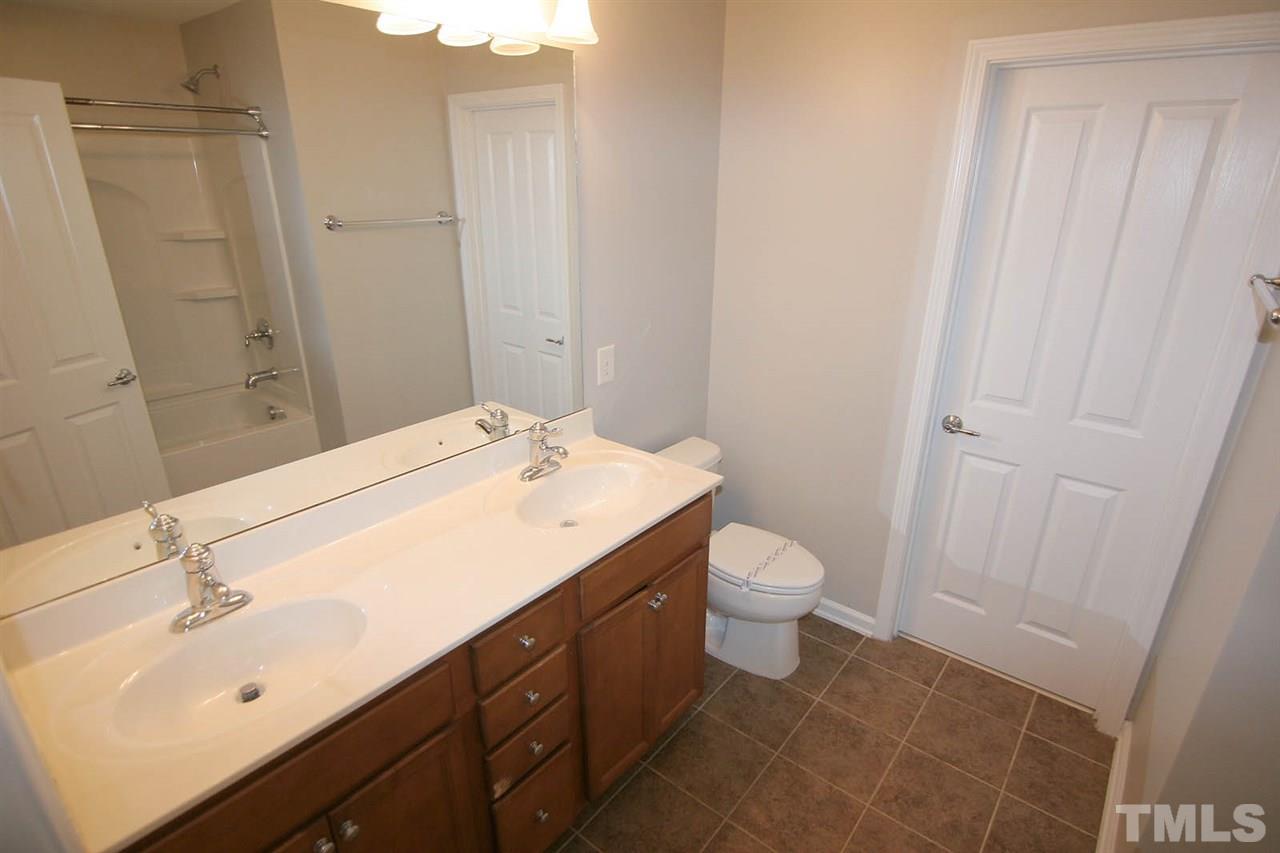 8614 Redcrest Place Raleigh, NC 27617 - Photo 12 of 16 a bathroom with a sink toilet and shower