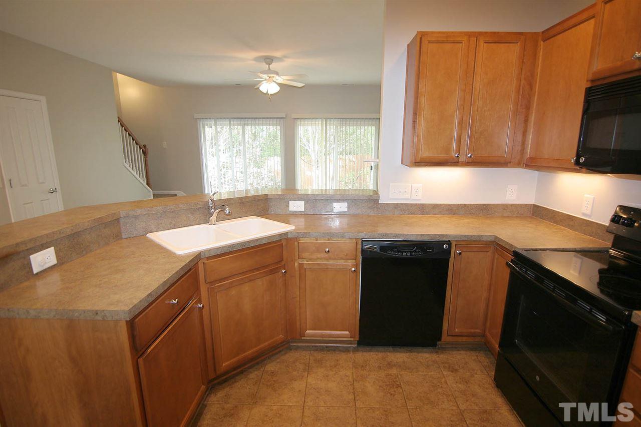 8614 Redcrest Place Raleigh, NC 27617 - Photo 3 of 16 a kitchen with a sink stove and microwave