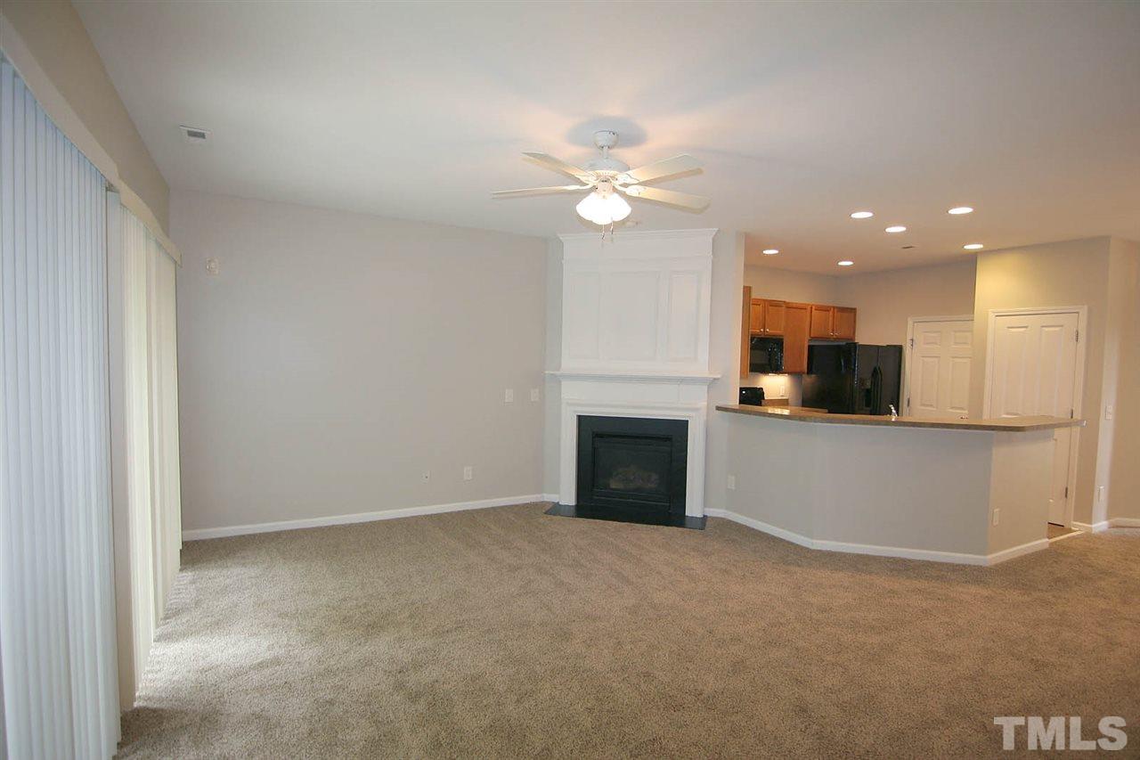 8614 Redcrest Place Raleigh, NC 27617 - Photo 4 of 16 a view of an empty room with kitchen and a window