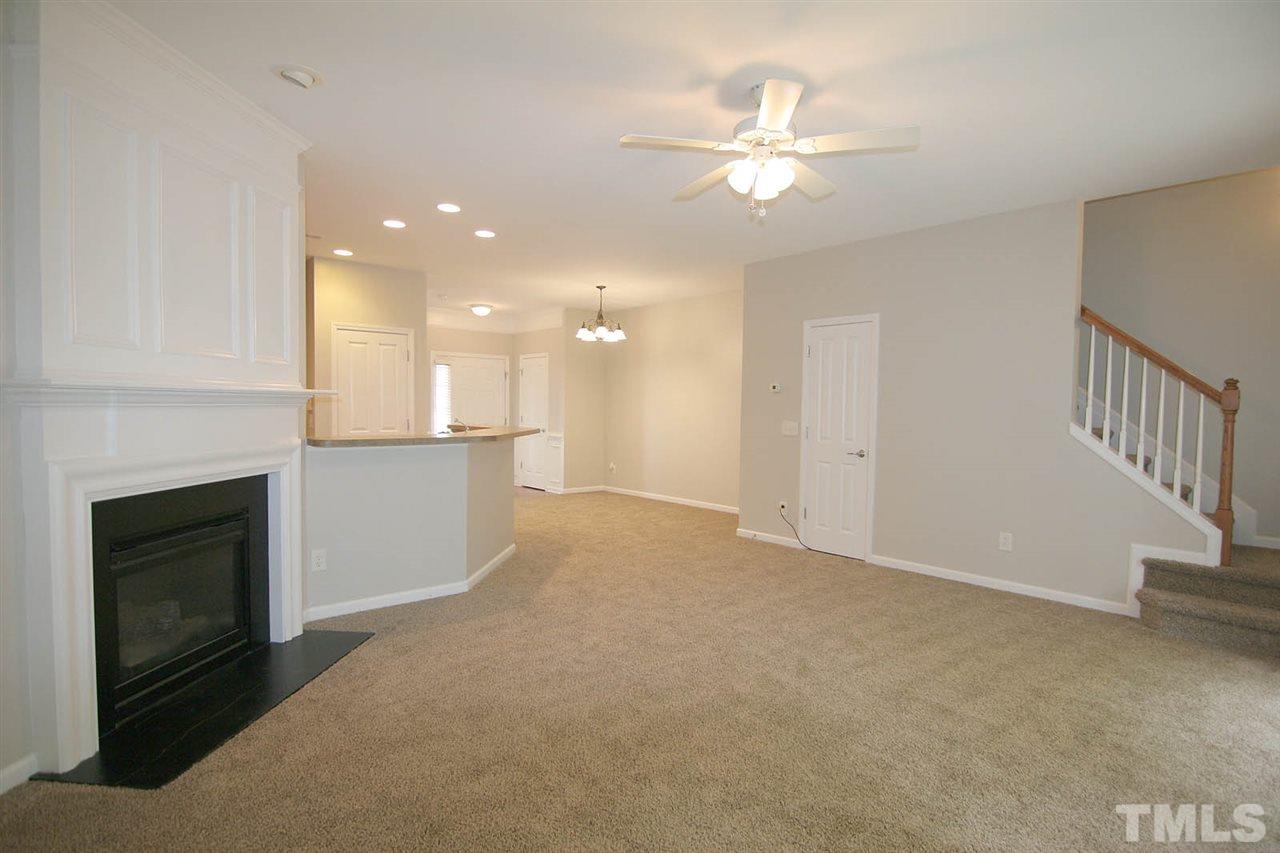 8614 Redcrest Place Raleigh, NC 27617 - Photo 5 of 16 a view of a kitchen with a sink and a fireplace
