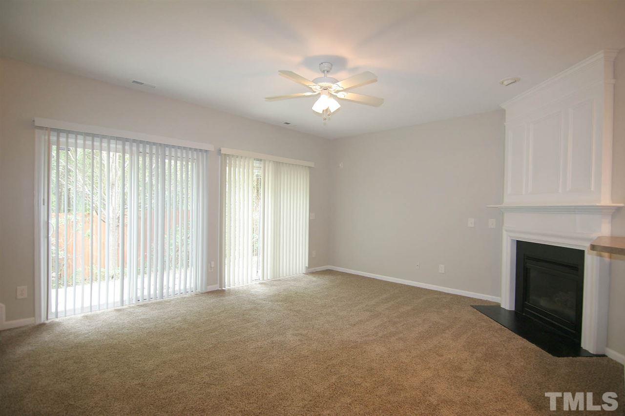 8614 Redcrest Place Raleigh, NC 27617 - Photo 6 of 16 a view of an empty room with a window