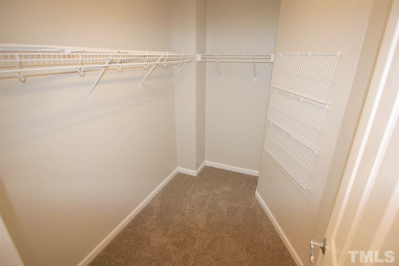8614 Redcrest Place Raleigh, NC 27617 - Photo 10 of 16 a view of a room with racks on the wall