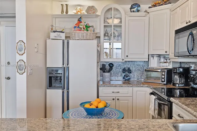 a bathroom with a sink toilet a mirror and shower
