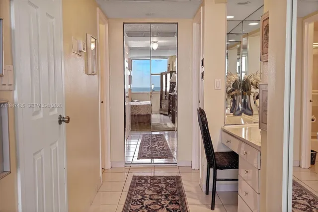 a bathroom with a granite countertop sink a mirror and a shower
