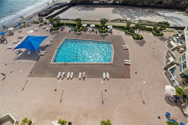 a lobby with furniture gym equipment and a view of living room