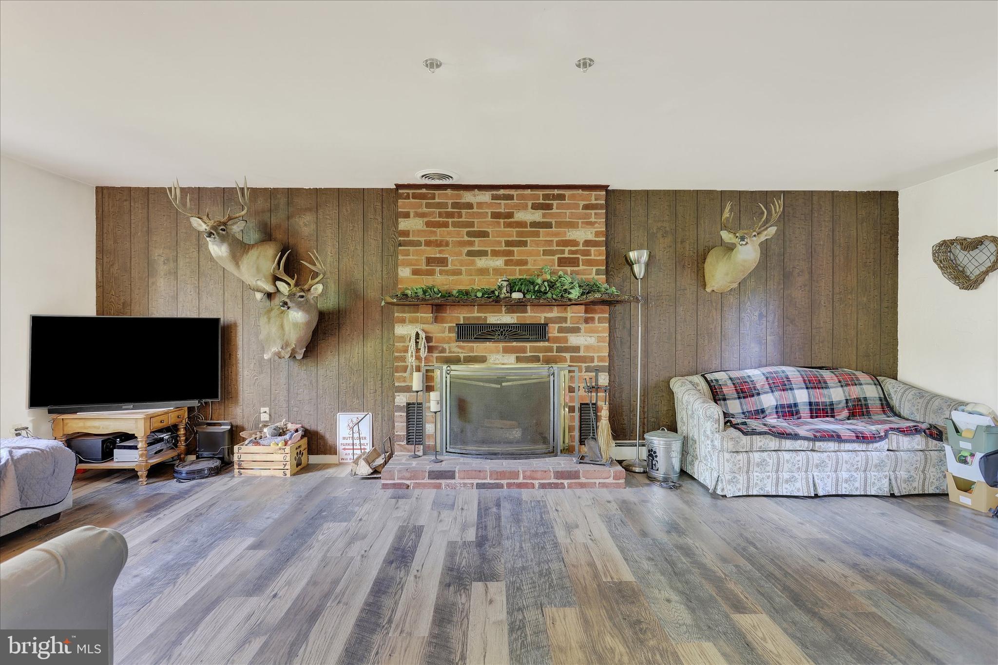620 St Johns Road Littlestown, PA 17340 - Photo 11 of 25 a living room with furniture and a flat screen tv