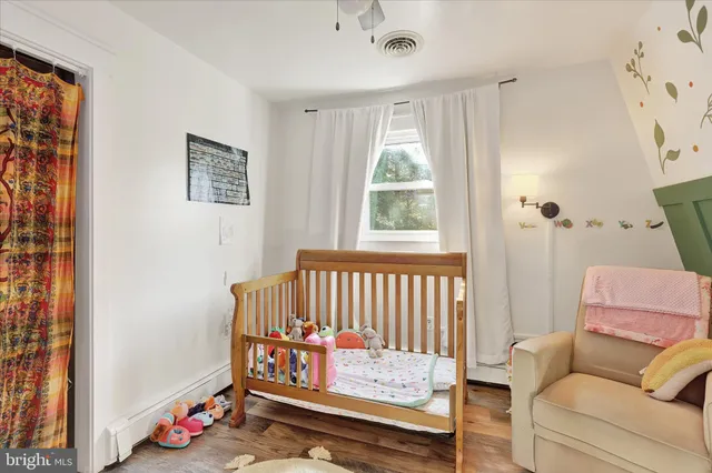 a bedroom with furniture and a window