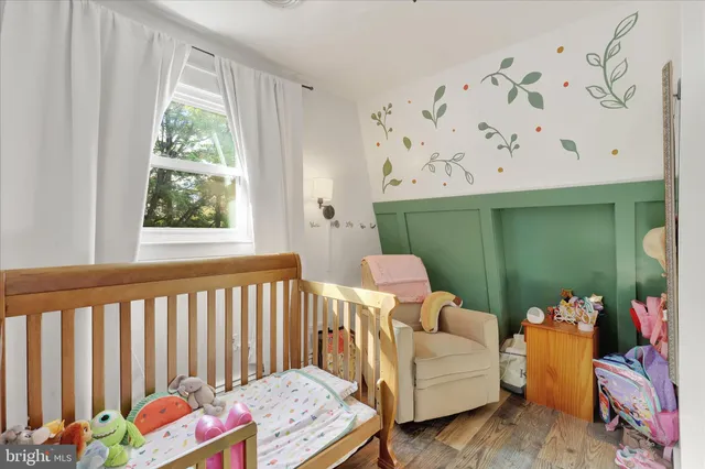 a bedroom with furniture and a window