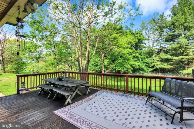a view of a wooden deck with a bench