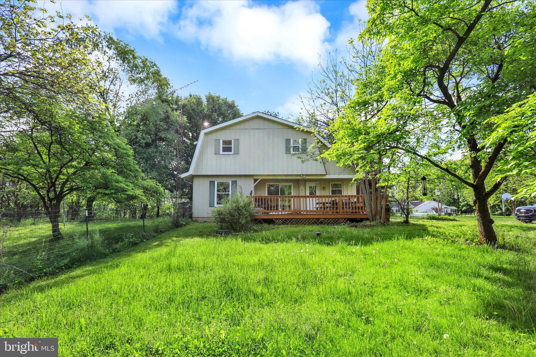 620 St Johns Road Littlestown, PA 17340 - Photo 19 of 25 a view of a house with a big yard and large trees