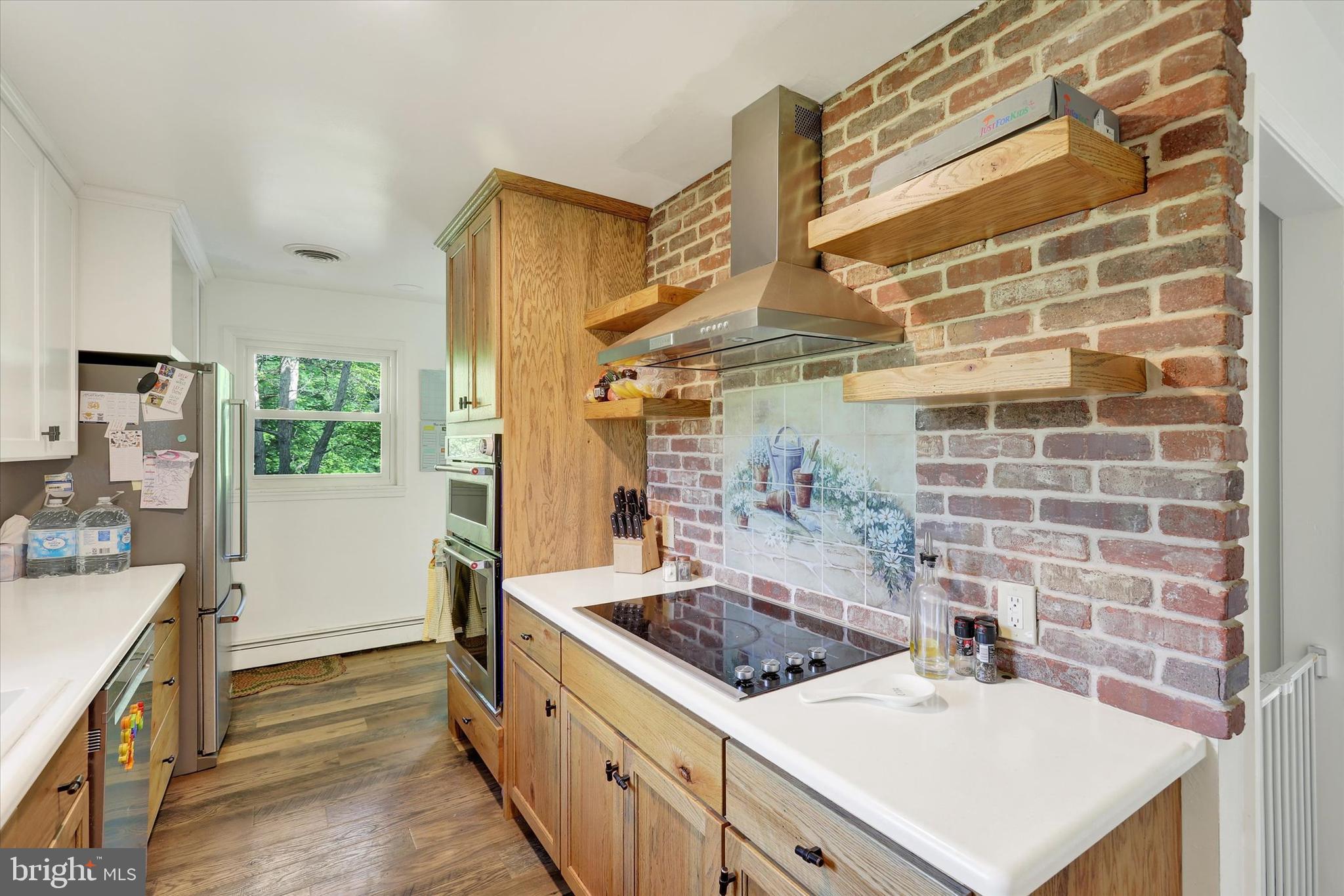 620 St Johns Road Littlestown, PA 17340 - Photo 4 of 25 a kitchen with a stove and a sink