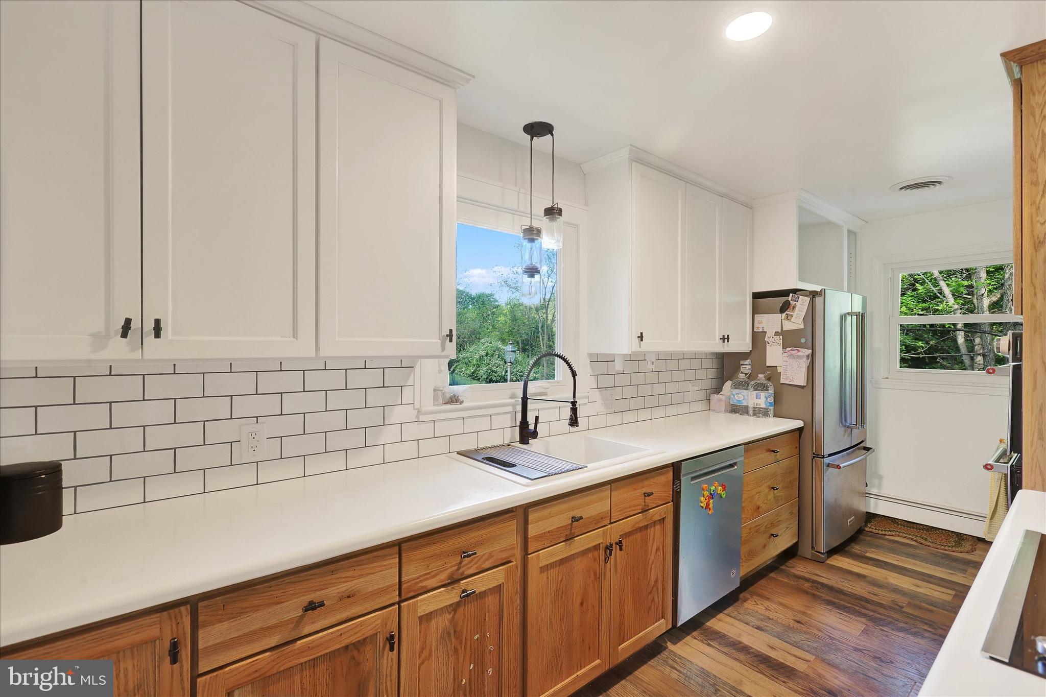 620 St Johns Road Littlestown, PA 17340 - Photo 5 of 25 a kitchen with sink cabinets and wooden floor