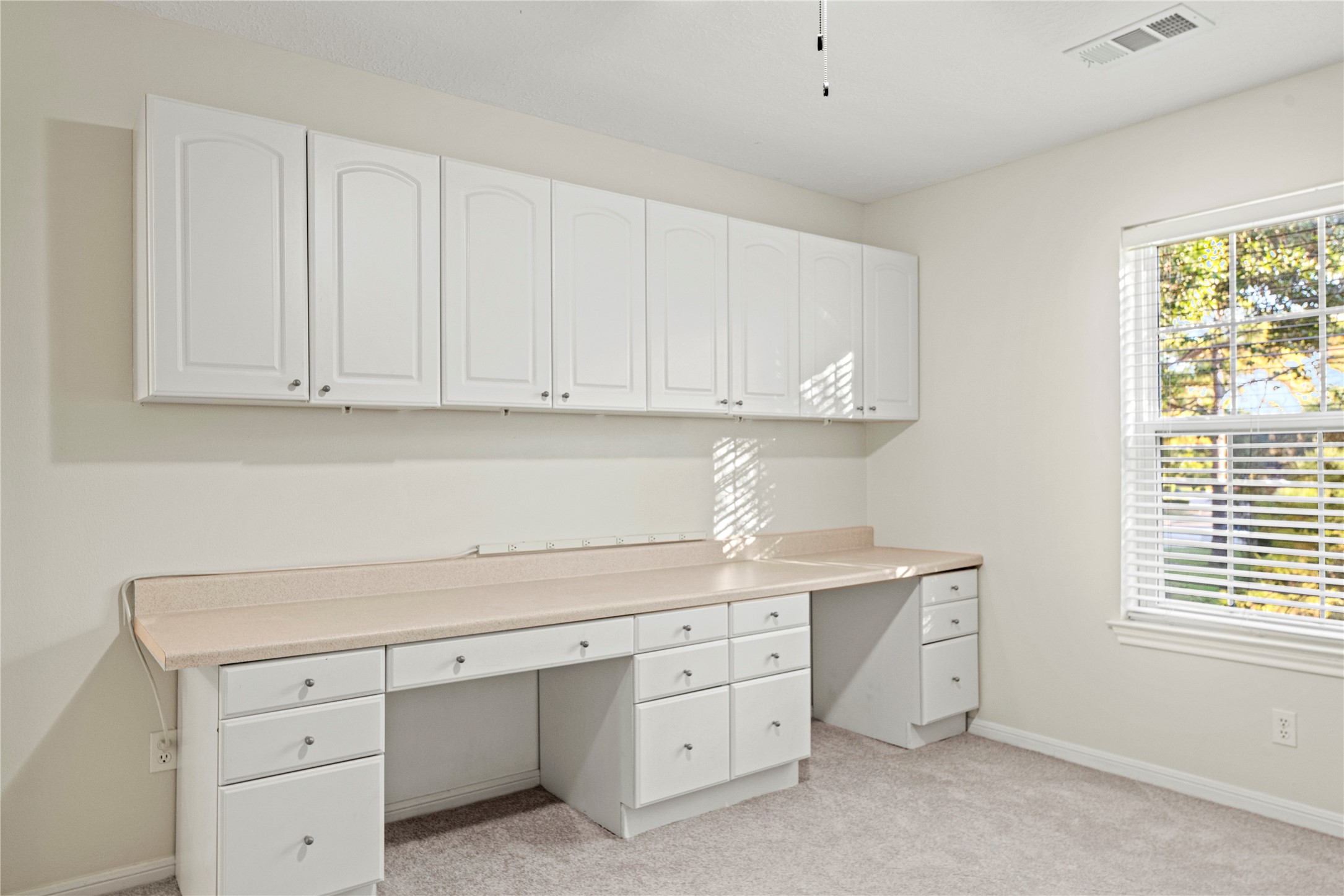 12502 Pavilion Court Tomball, TX 77377 - Photo 28 of 37 Upstairs bedroom with built-in desks and storage.