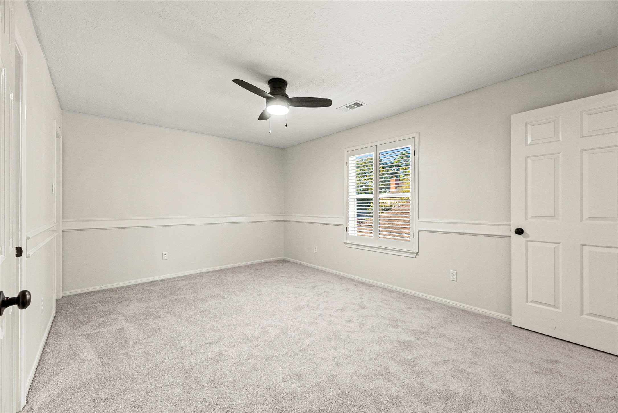 12502 Pavilion Court Tomball, TX 77377 - Photo 31 of 37 All bedrooms offer new carpet, ceiling fans and walk-in closets.