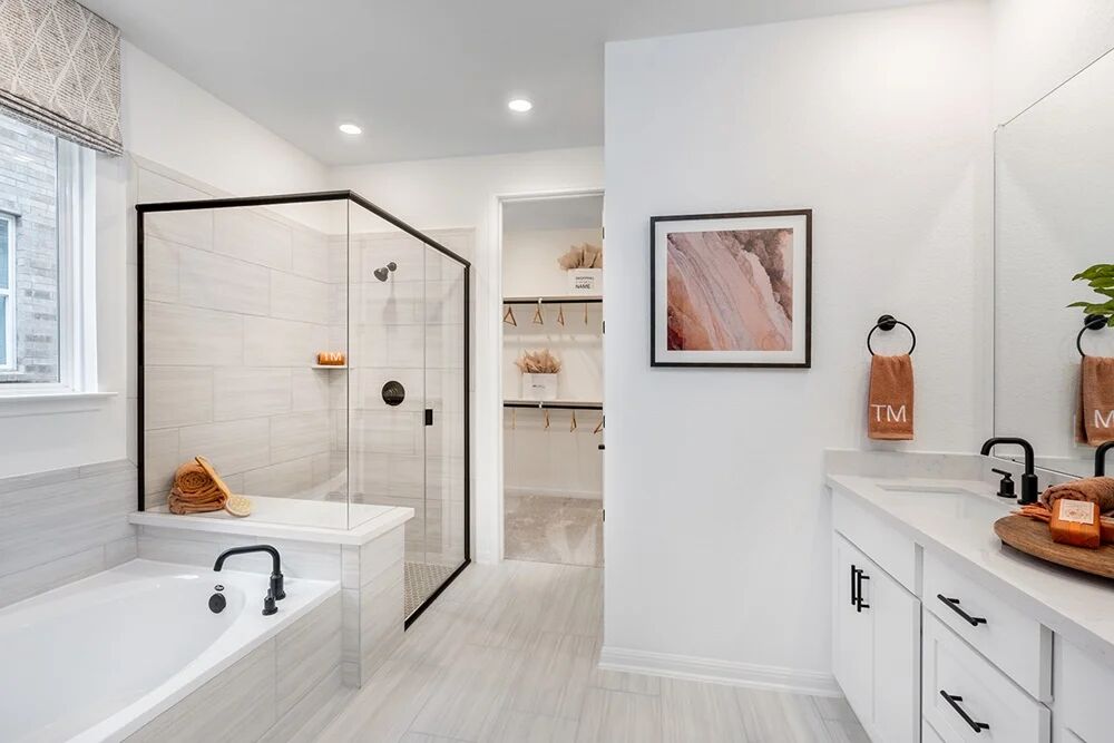 1912 Montella Way Leander, TX 78641 - Photo 7 of 31 a bathroom with a tub sink and mirror