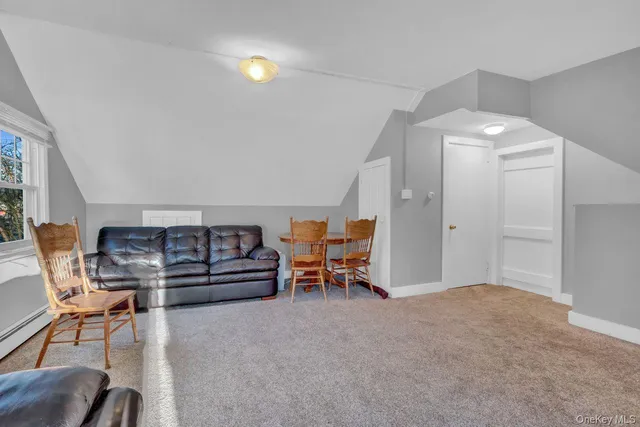 a bedroom with furniture and a chandelier