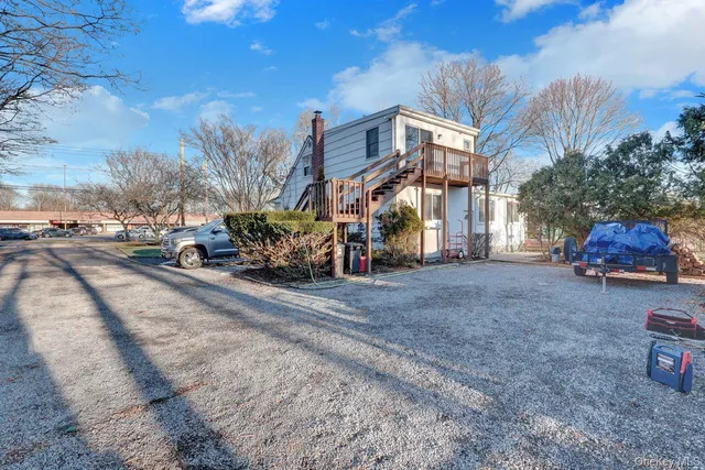 a street view with couple of cars parked on road