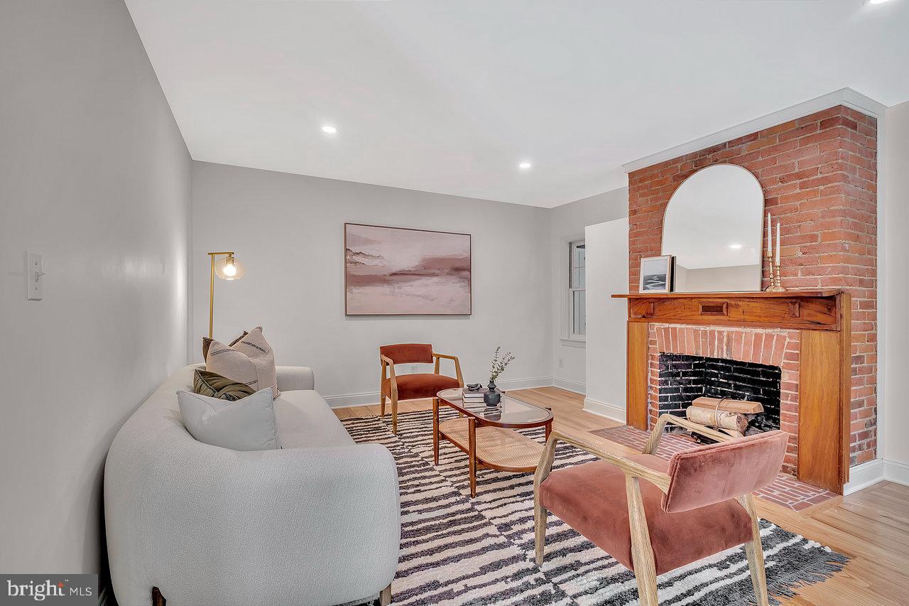 513 Cherry Valley Road Princeton, NJ 08540 - Photo 15 of 52 a living room with furniture and a fireplace