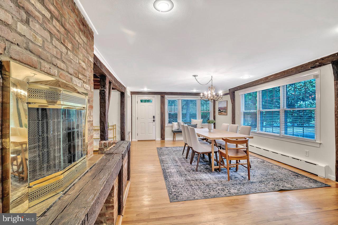 513 Cherry Valley Road Princeton, NJ 08540 - Photo 22 of 52 a dining room with wooden floor and large window