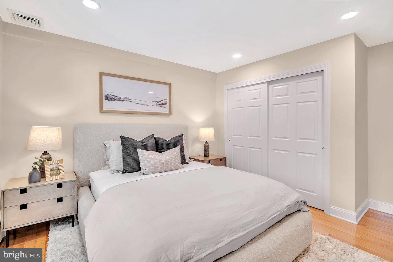 513 Cherry Valley Road Princeton, NJ 08540 - Photo 31 of 52 a spacious bedroom with a bed and a lamp