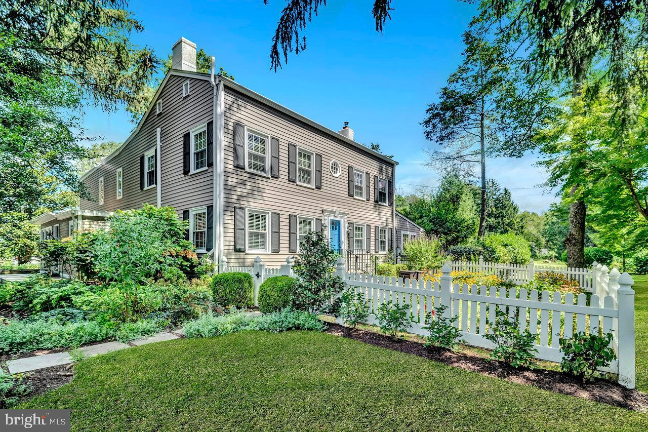 513 Cherry Valley Road Princeton, NJ 08540 - Photo 4 of 52 a front view of a house with a yard
