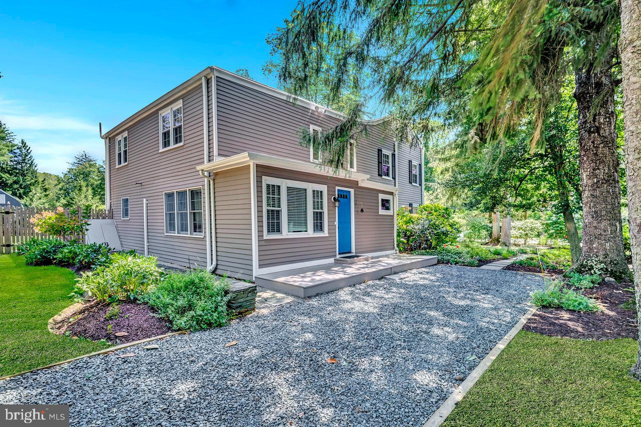 513 Cherry Valley Road Princeton, NJ 08540 - Photo 5 of 52 a front view of a house with garden