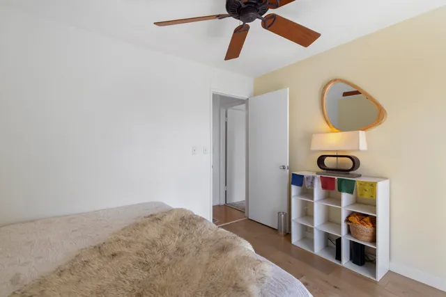 a view of a balcony with floor to ceiling windows with wooden floor