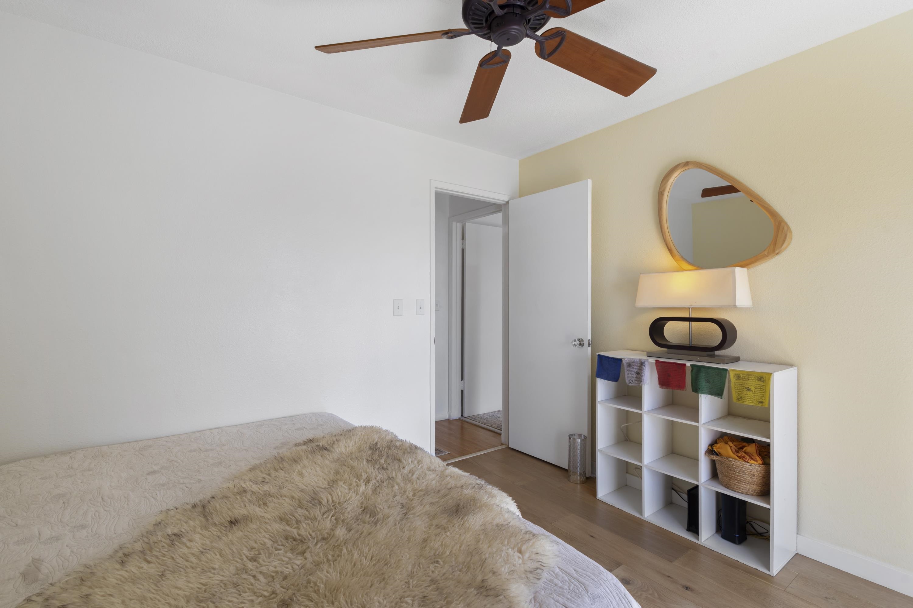 160 Keonekai Road, Unit 22201 Kihei, HI 96753 - Photo 11 of 37 a bedroom with a bed and cabinets